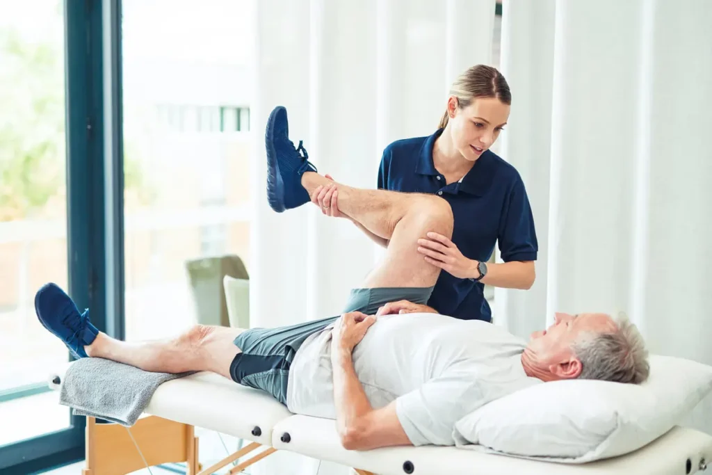 Revitalising Recovery: Effective Rehabilitation Strategies for Muscle Injuries 3 Physiotherapist assisting a patient with muscle recovery exercises West Bridgford